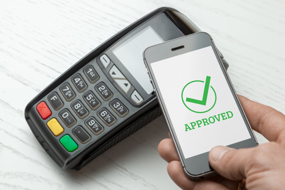 POS terminal, Payment Machine with mobile phone on white background. Contactless payment with NFC technology. Payment approved.